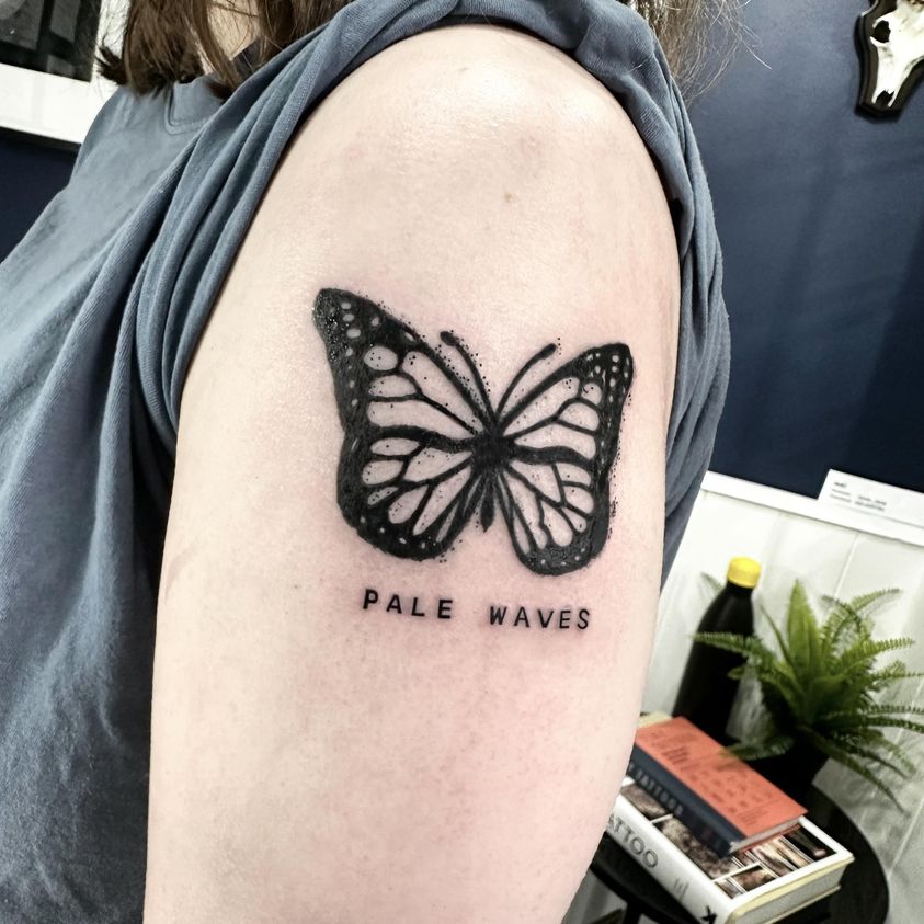 Black butterfly tattoo by Markings Tattoos Hessle