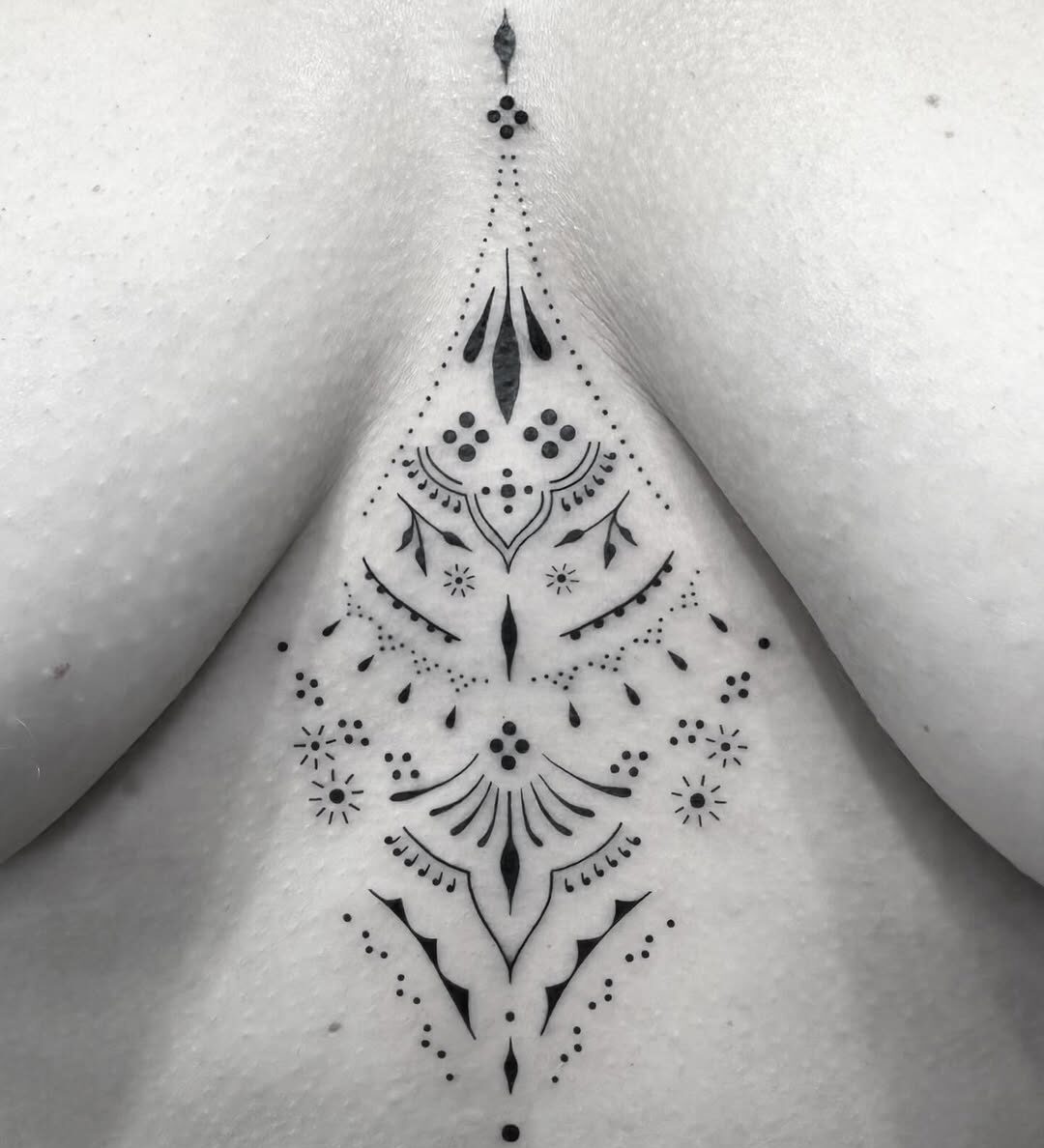 Sternum mandala tattoo by Markings Tattoos Hessle
