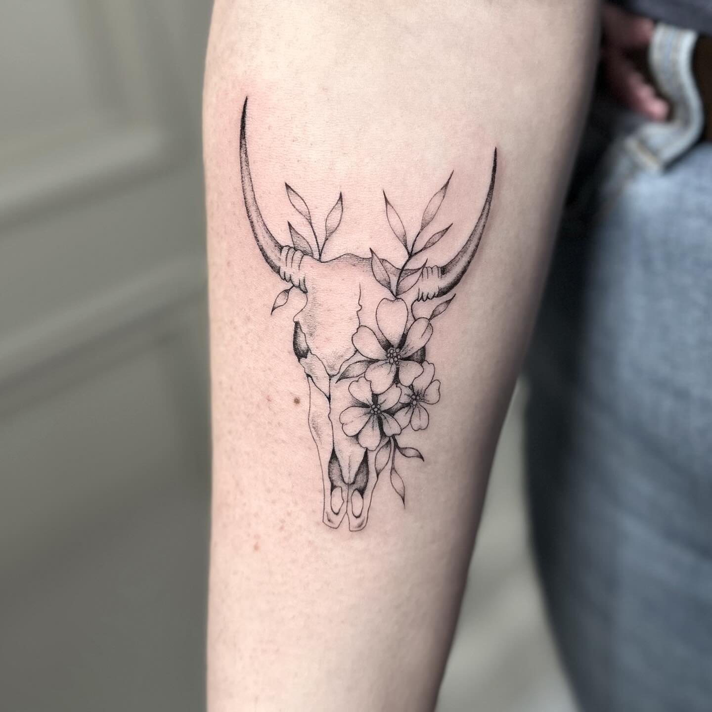Buffalo skull and flowers tattoo by Markings Tattoos