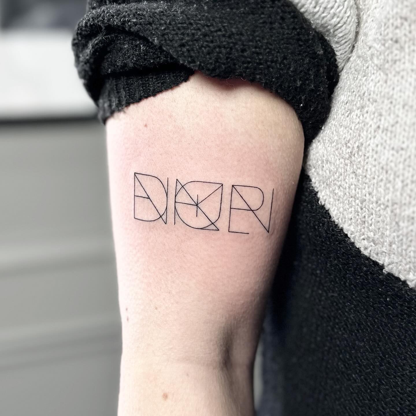 Family initials tattoo by Markings Tattoos