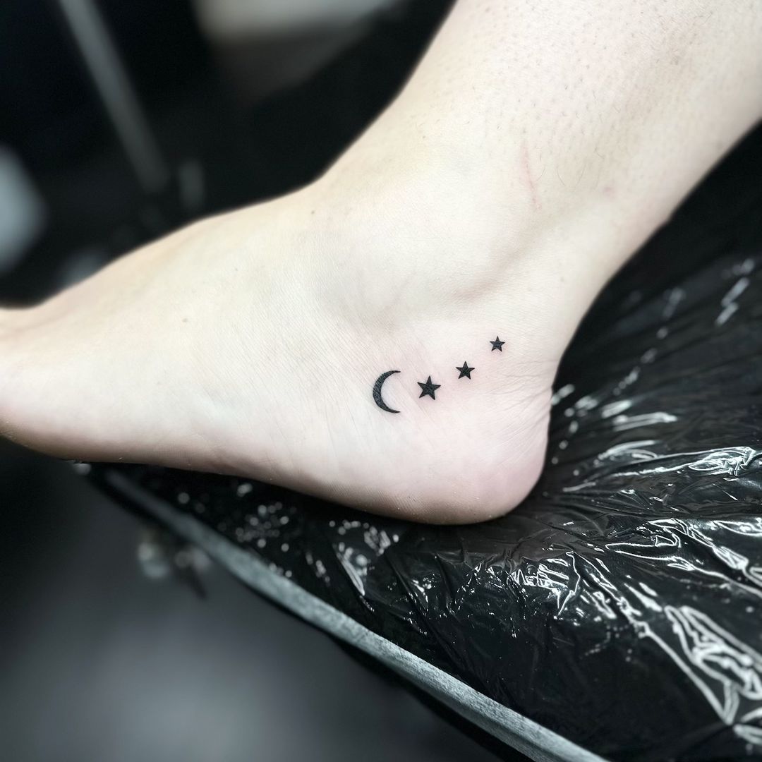 Moon and stars tattoo by Markings Tattoos