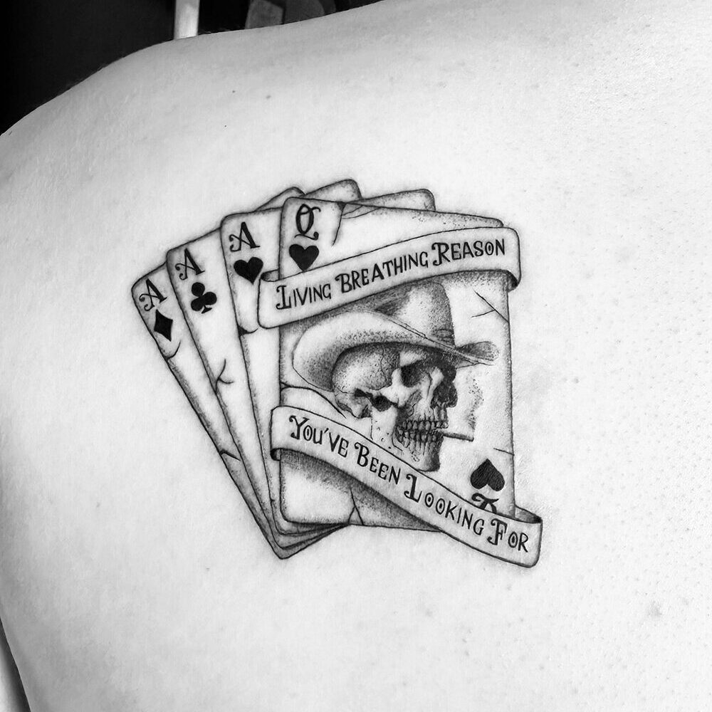 Cowboy skull and cards tattoo by Markings Tattoos