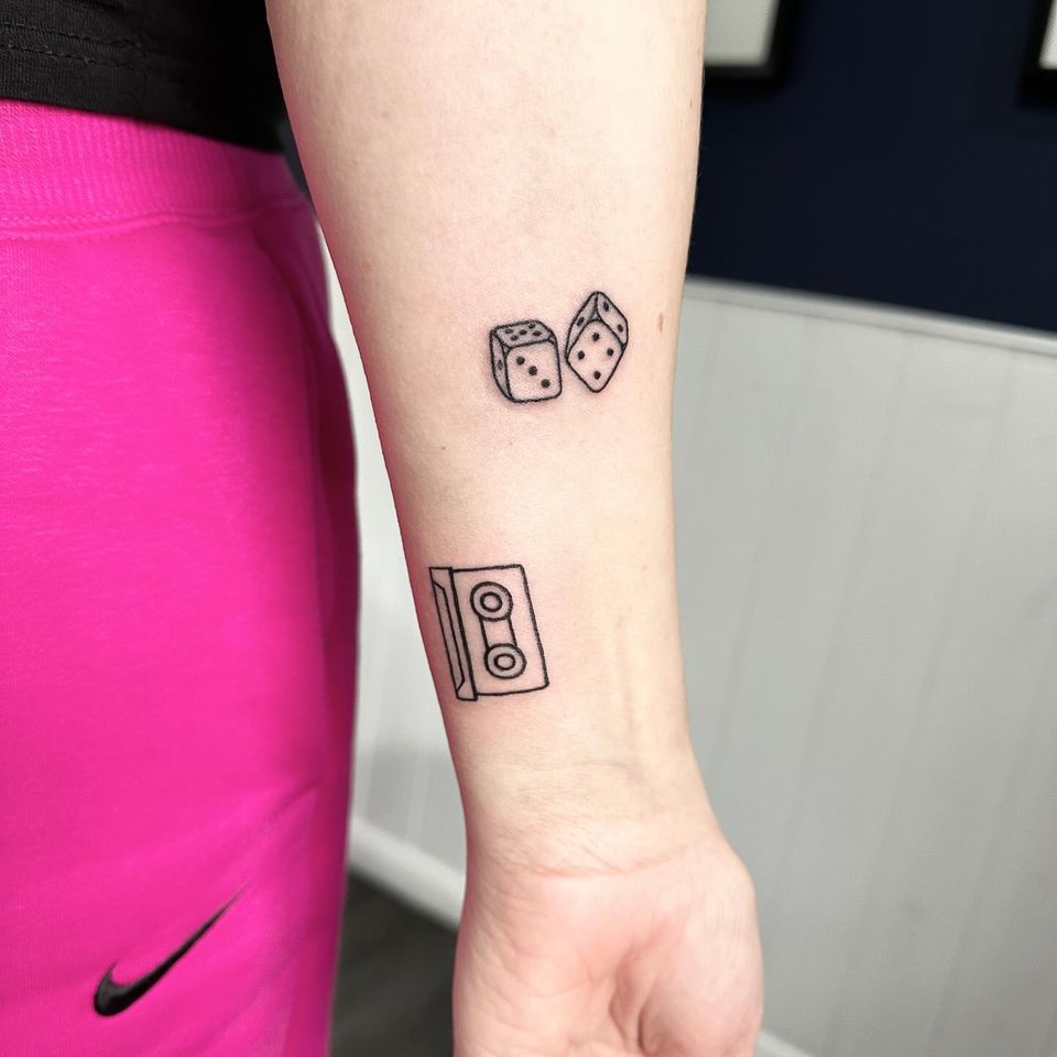 Dice and cassette tape tattoo by Markings Tattoos